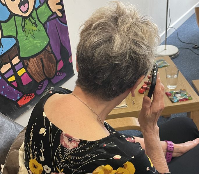 A carer receiving counselling over the phone