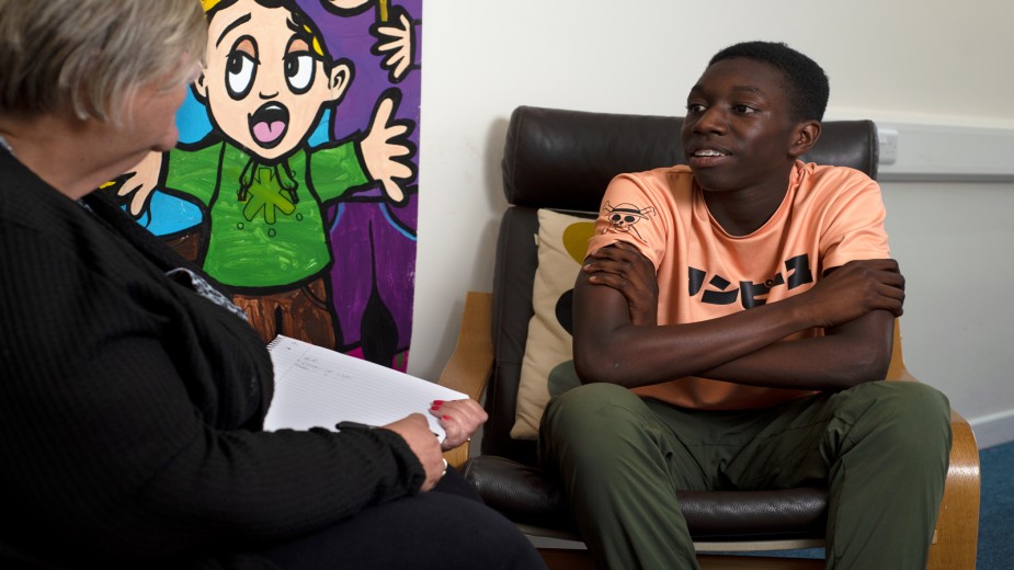 A young carer in a one-to-one session with a care worker