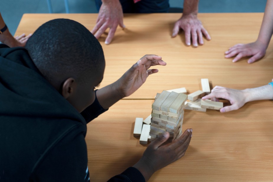 Young carers playing Jenga